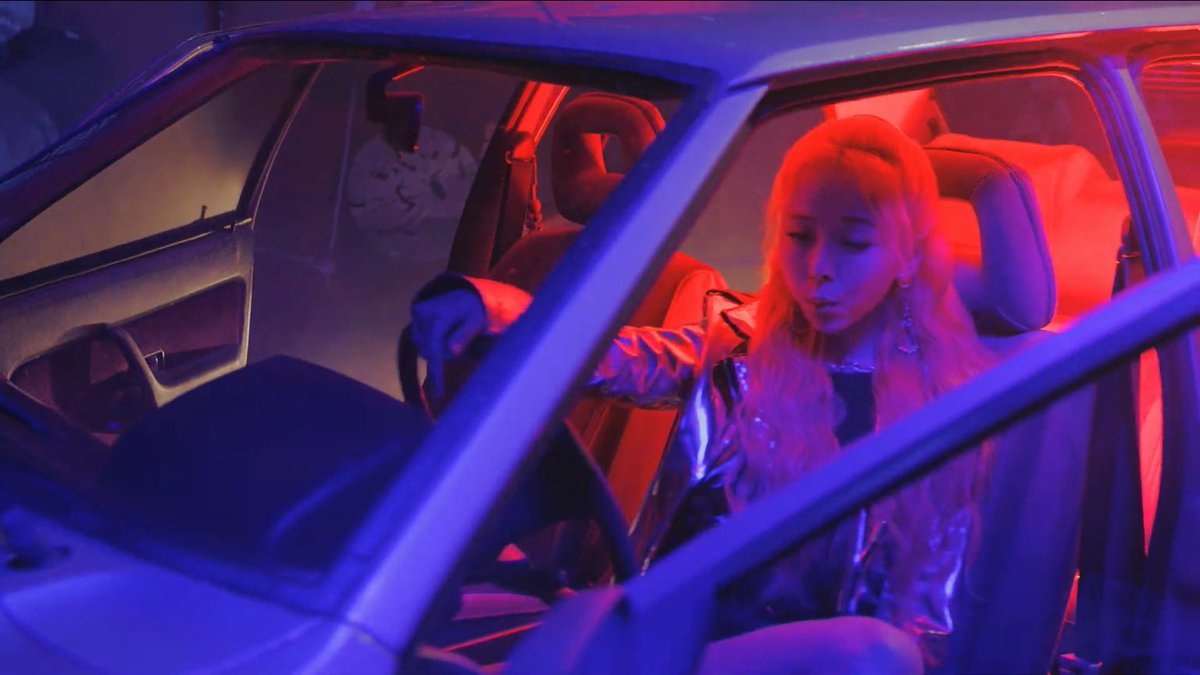 the benz signifies her desire to become “new” & escape the “old”, symbolized by the old 90s car. vivi is in the car, & edily is a 90s concept. yves then disappears, alluding to her escape in “love4eva”. vivi is now looking for her, but shes surrounded only by her essence (apples)