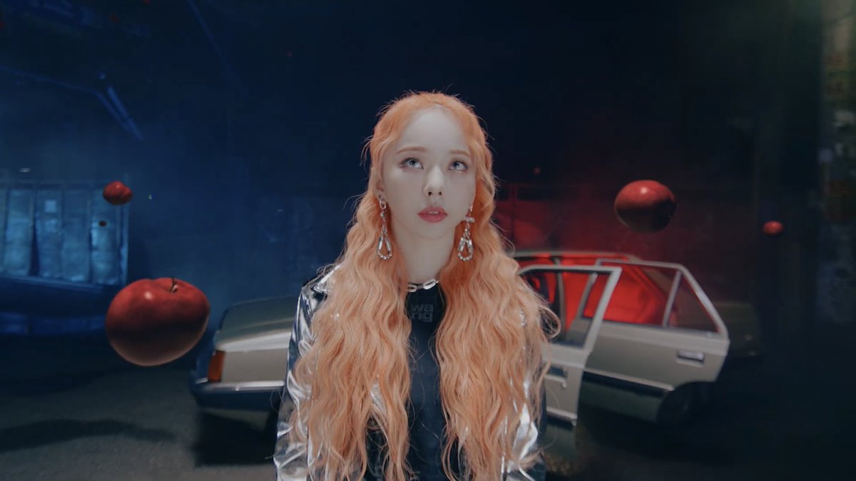 the benz signifies her desire to become “new” & escape the “old”, symbolized by the old 90s car. vivi is in the car, & edily is a 90s concept. yves then disappears, alluding to her escape in “love4eva”. vivi is now looking for her, but shes surrounded only by her essence (apples)