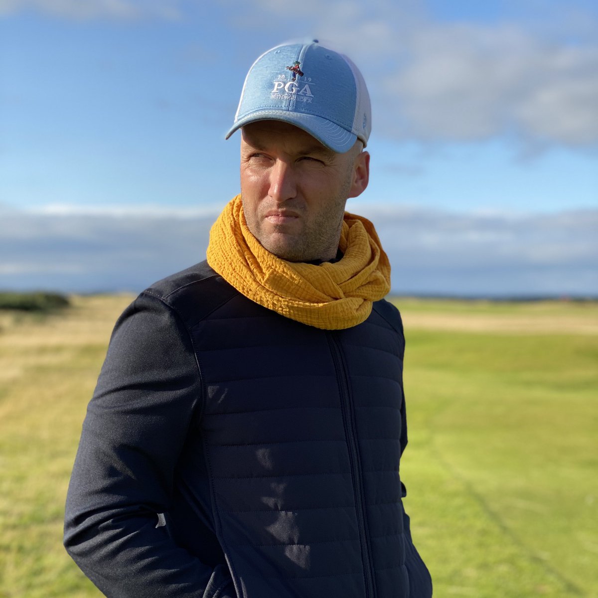 Mustard Yellow Infinity Scarf from The Wee Bramble, handmade in Scotland 🏴󠁧󠁢󠁳󠁣󠁴󠁿 
This is the perfect addition to your golfing attire. #winteriscoming Be prepared! 🏌🏼‍♂️⛳️ Modelled by our very own <a href="/GavNeill/">Gavin Neill</a> 
#followthebramble #standrews #golf #infinityscarf