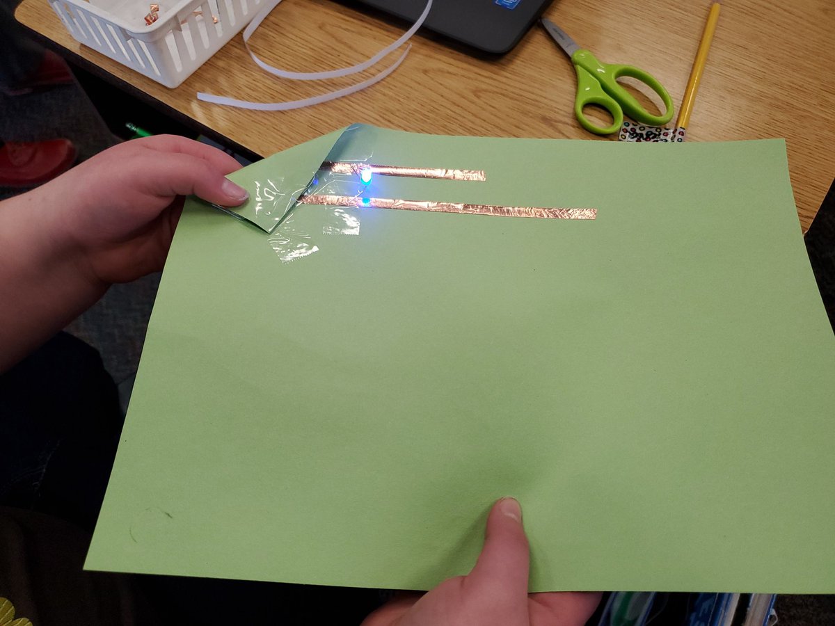 MsWalkama's tweet image. Another electricity activity: paper circuits! Students were challenged to follow directions for making their circuit out of copper tape, LED bulbs, and cell batteries and then building it completely independently. Terra was the first to successfully build her circuit! #lionpride