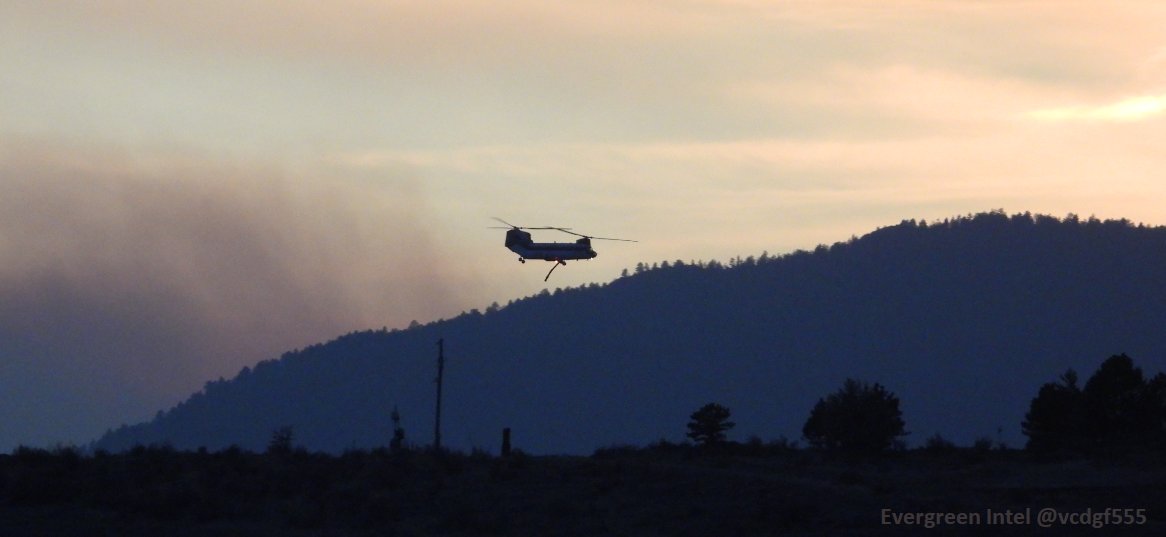 A different angle (and different lighting) of the same pass of Columbia Helicopters Inc CH-47D N472CH (A5C8C2) just west of Loveland, CO. The smoke in the background is actually the Calwood Fire near Boulder that burned at least 26 homes and 8800 acres so far.