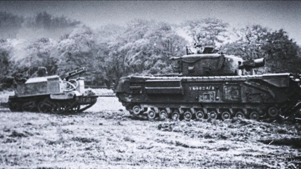 In addition to the regular rations, supplies, petrol and ammunition, one lorry carried three tons of liquid nitroglycerine. This highly unstable explosive was for the “Conger,” a Bren carrier adapted to launch a flexible hose across a minefield. Churchill AVRE towing Conger