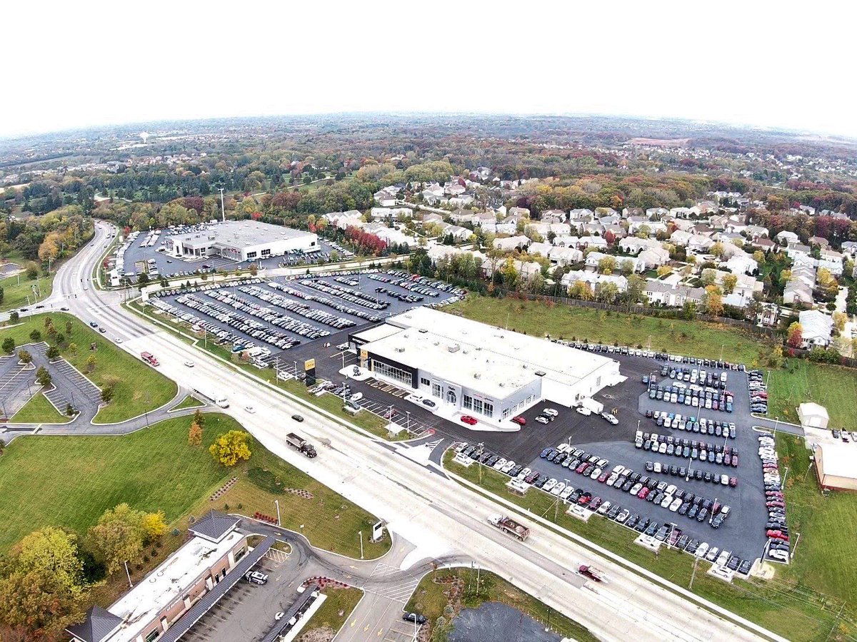 MissnerGroup's tweet photo. An #aerial view of the newly constructed Elgin Chrysler Dodge Jeep Ram neighboring Elgin Toyota, both owned by the Bob Loquercio Auto Group. #OpenForBusiness #DealershipConstruction @ElginToyota1 https://t.co/IynPf9x9sa