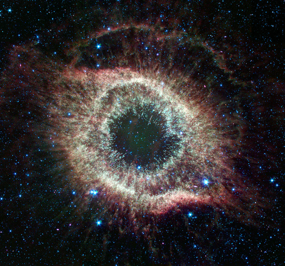 👀Something's Watching👀 @NASAspitzer peered at the Helix nebula in infrared and it appeared to be looking back. The space telescope mapped the structure of the dying star unraveling into space – about 700 light-years away in the constellation Aquarius. #NASAHalloween