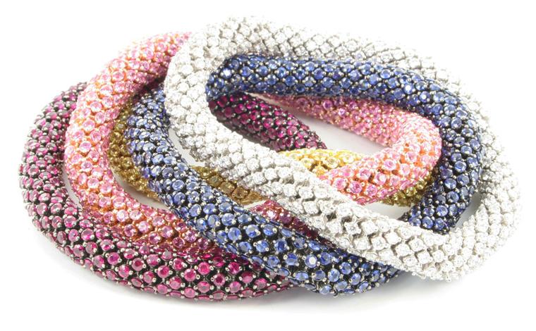 From Bucci, flexible bracelets with pave set stones, willing to bet the blue one is sapphire. Pink one might be, too.