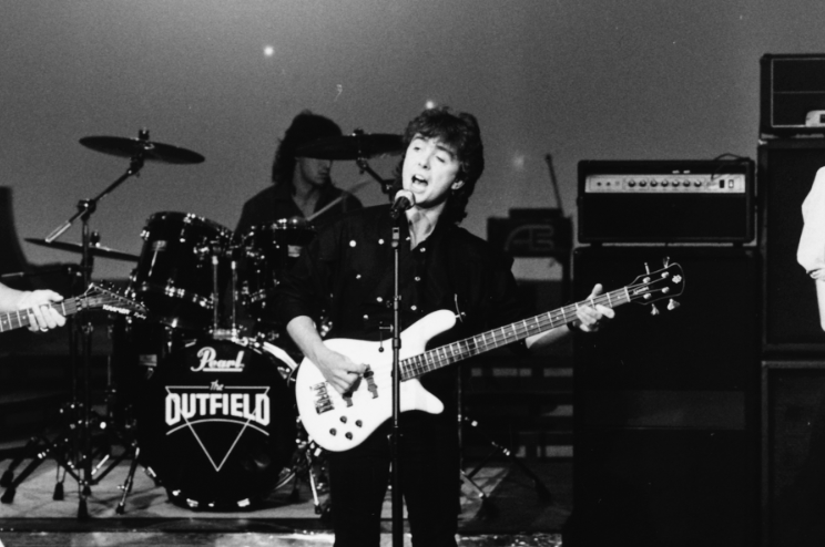 RollingStone's tweet photo. Tony Lewis, the singer-bassist whose pop-rock group The Outfield scored a massive hit in 1986 with "Your Love," has died at age 62 https://t.co/tmbn6CA7dm https://t.co/McLcaLPRdg