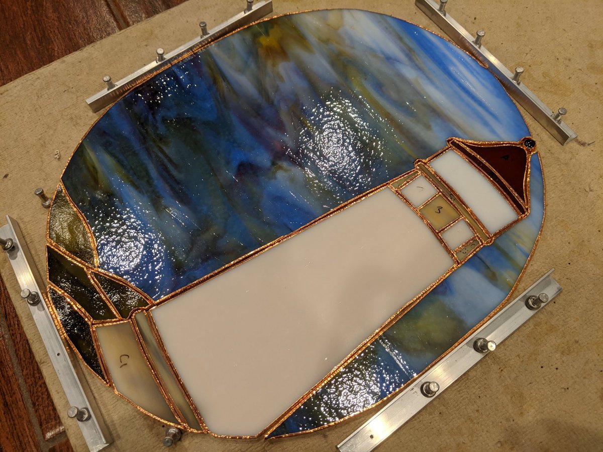 NumberOneBean's tweet image. Current stained glass project underway. Foiling completed - solder time.