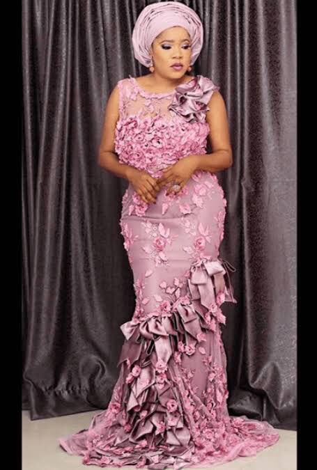 Toyin Abraham pink as a fine Gerard Bertrand Rose bottle