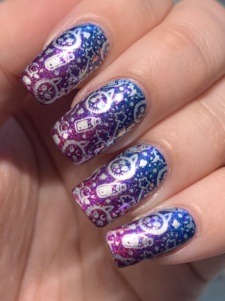 nailsbybriony's tweet photo. These were my last set of Halloween nails for 2020, and were celebrating 1000 followers on Instagram! I did a gradient, topped it with unicorn skins, and stamped over the top ๐ #nailart #holotaco #maniology #nailstamping #nailgradient https://t.co/XQ6b2584DY