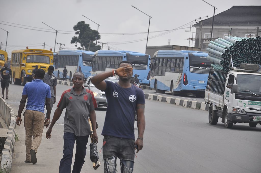 daily_trust's tweet photo. BRT buses on queue to carry passengers at Iyana-Ipaja after the #endsars crisis that led to the setting ablaze of many of the buses. November 2, 2020. Photo: Benedict Uwalaka. https://t.co/A5BXF6D2Fv