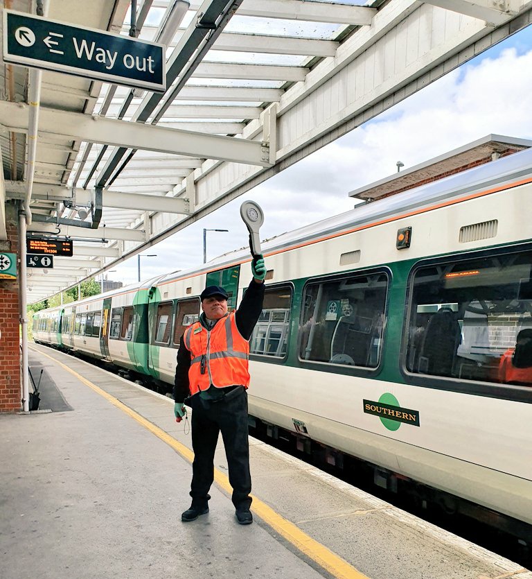 If the PIC cannot see the whole length of the train, they will need an assistant dispatcher (AD). Depending on the length of the train or the curvature of the platform, the PIC may need more than one AD. – bei  Horsham Railway Station (HRH)