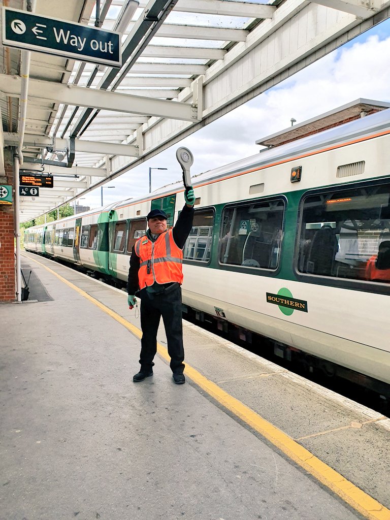 The additional dispatcher furthest from the PIC (unless the PIC is dispatching alone) raises their bat to the next dispatcher to signal "close doors".This signal is repeated by each AD until it reaches the PIC. &ndash; bei  Horsham Railway Station (HRH)