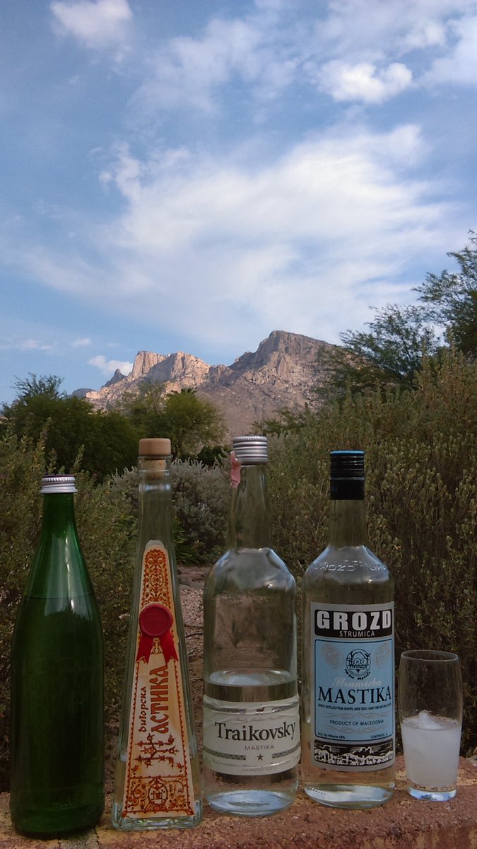 JasonMiko's tweet photo. Sunday, November 1, my backyard, Southern Arizona, about 3 pm. 87F/31C and so many choices (the one on the left is домашна) outside listening to #Macedonia/n music. I jealously guard and judiciously enjoy my Macedonian mastika. https://t.co/WygII58zzQ