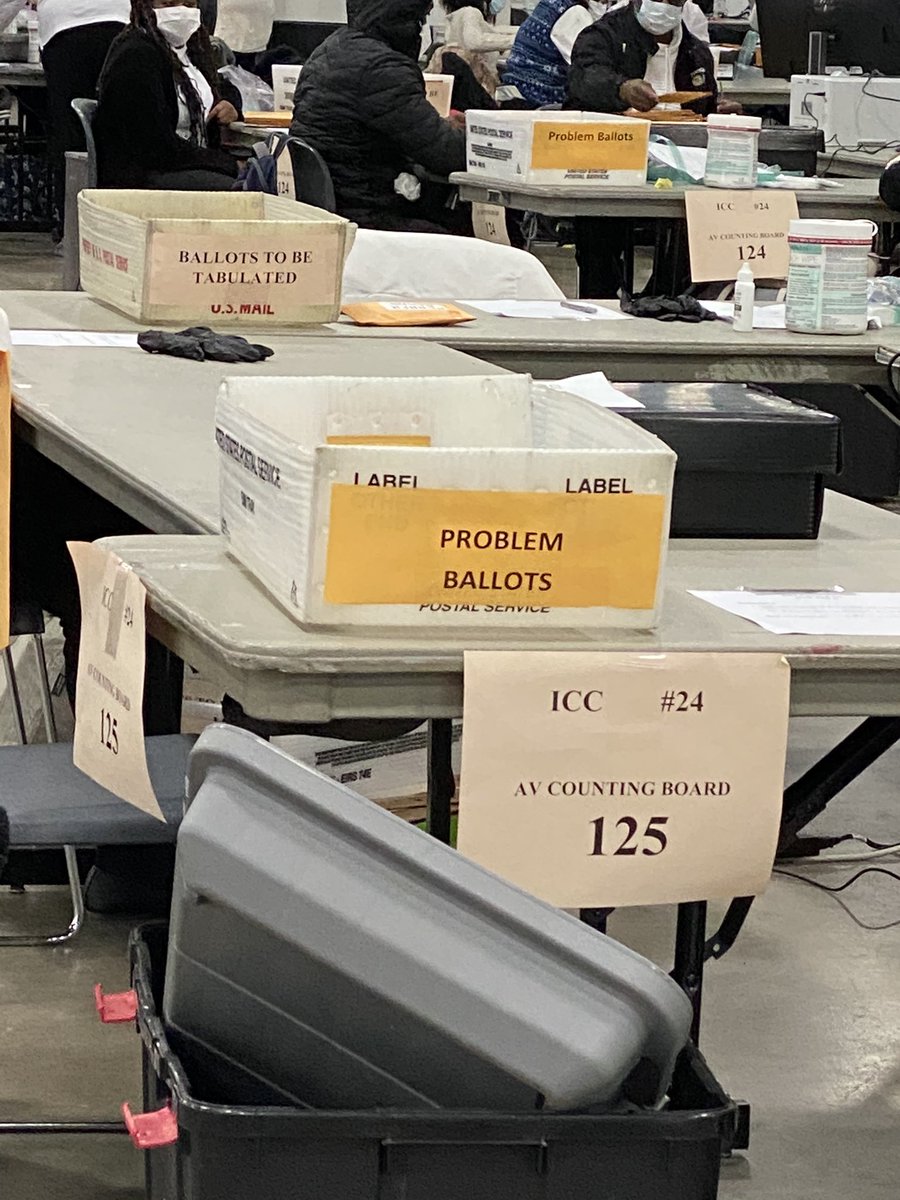 At each table there is a bin for “problem ballots” (variety of reasons) and ballots that have been processed and are ready to be tabulated.