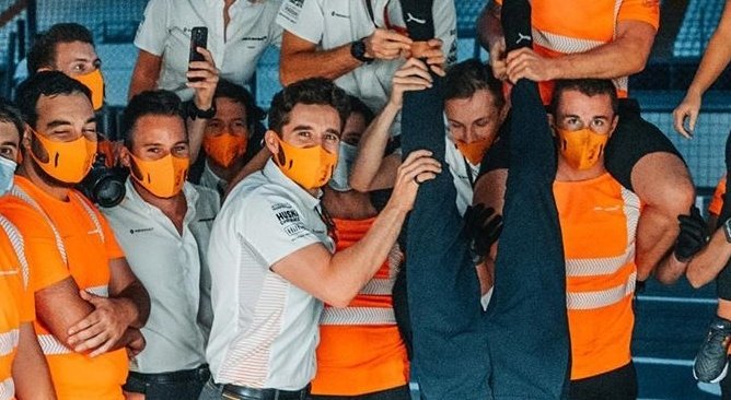 Jon smiling through the pain, cause he does not want to see Lando fall at Monza: