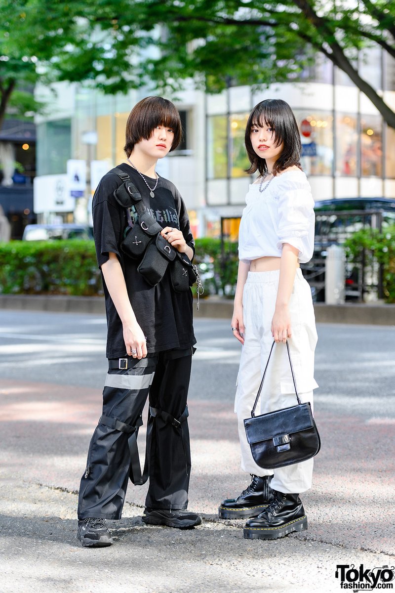 Tokyo Fashion 18 Year Old Japanese Students Yuika And Unu On The Street In Harajuku Wearing Monochrome Street Styles With A Billie Eilish Tee Reflector Strap Pants A Crossbody Utility Bag Prada