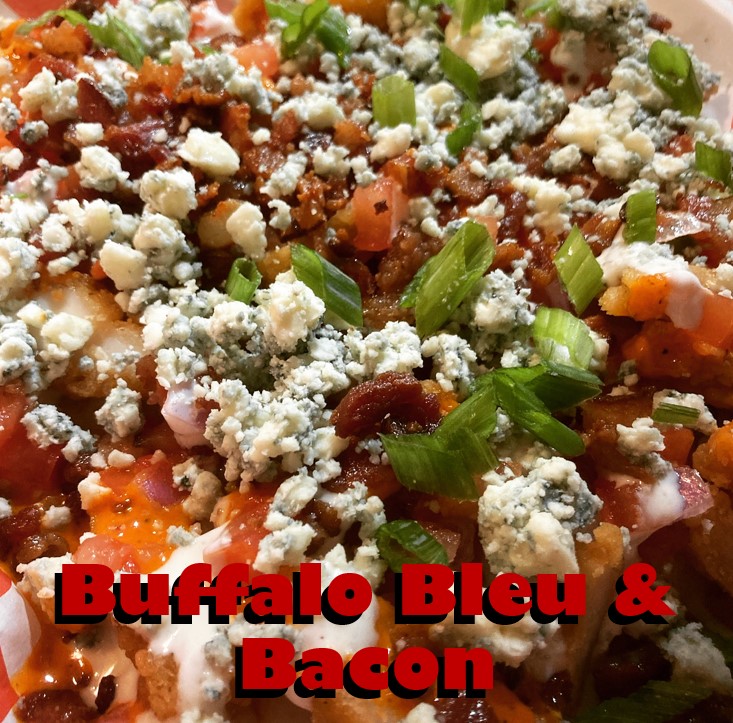Buffalo Bleu & Bacon Nachos (11/10-11/14): tortilla chips, house-made queso, crispy chicken, your choice of Buffalo sauce (recommended: Spicy Garlic), ranch dressing, blue cheese crumbles, bacon crumbles, and scallions (3/4)