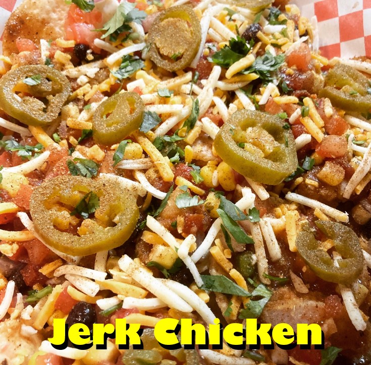 Jerk Chicken Nachos (11/3-11/6): tortilla chips, house-made queso, crispy chicken, Mud Island Jerk sauce, black bean and corn salsa, pico de gallo, shredded cheese, pickled jalapenos, cilantro, and Caribbean Heat seasoning (2/4)