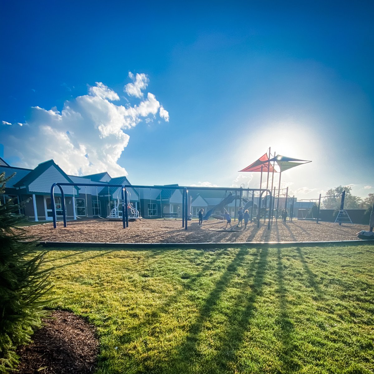 DCDSchool's tweet photo. “The sky is the daily bread of the eyes.” – Ralph Waldo Emerson. A great picture of the Lower School playground in the morning light. What a beautiful setting! #dcds #lowerschool #dcdsfun #education #playground #dcdsconnected 🐝💛💙 https://t.co/SdsM81UWbf