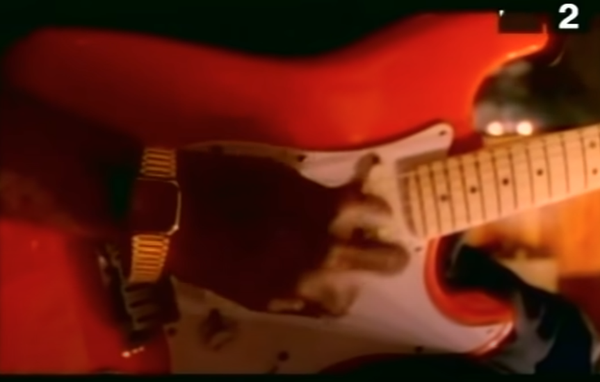 he's actually in the video, but if you blink you'll miss it.