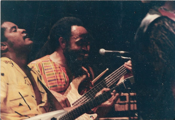 my dad, seen here with some jackass. and an older picture of him doing his thing. he looooves music.