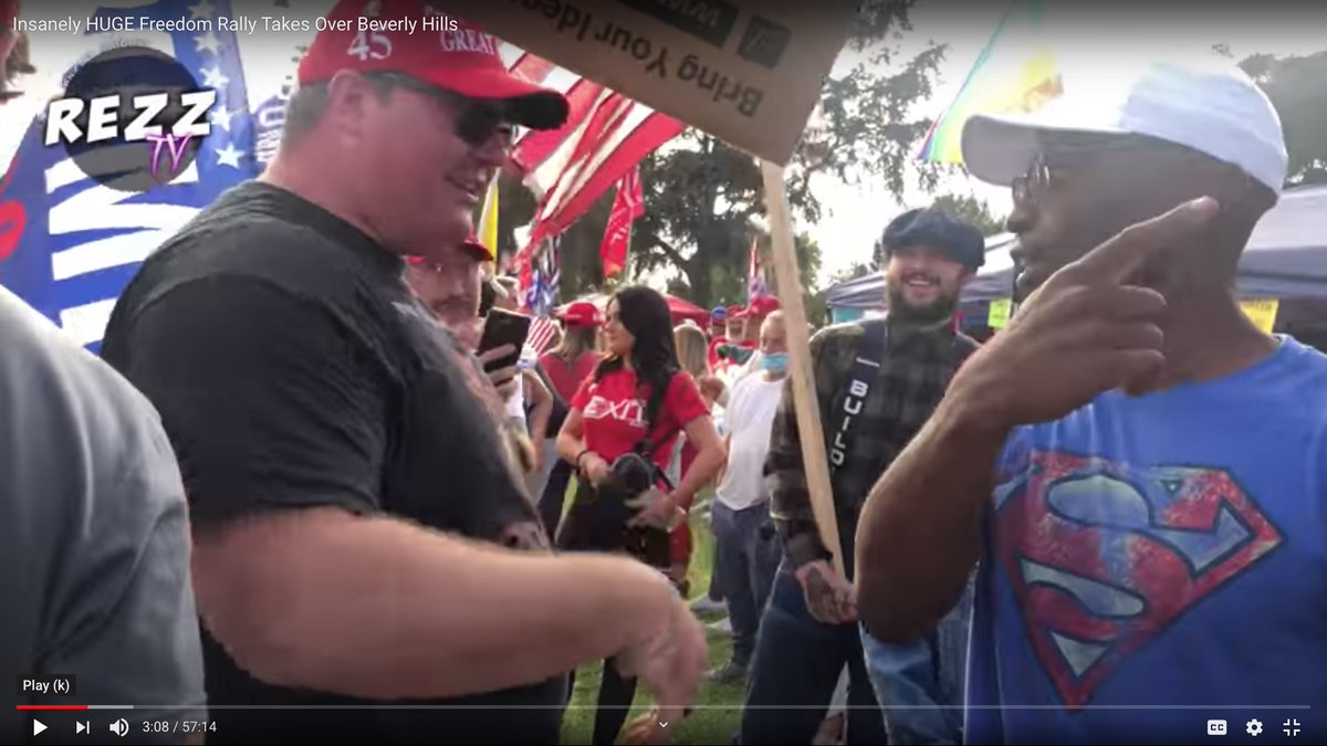 Gay activist (right) and heartland patriot (left) united by Trump and FREE HOT DOGS.