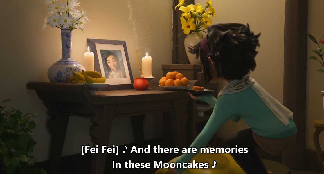In Chinese families that have experienced a loss, it's common to have an altar like this dedicated to the loved one, with a picture of them and offerings of fruit