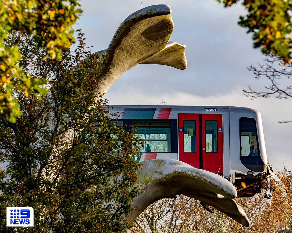 9NewsSyd's tweet photo. What a fluke – a sculpture of a whale’s tail has caught a train after it crashed through barriers in the Dutch city of Rotterdam. #9News 

Read More: https://t.co/wJabm1larV https://t.co/k3OiMh0lLy