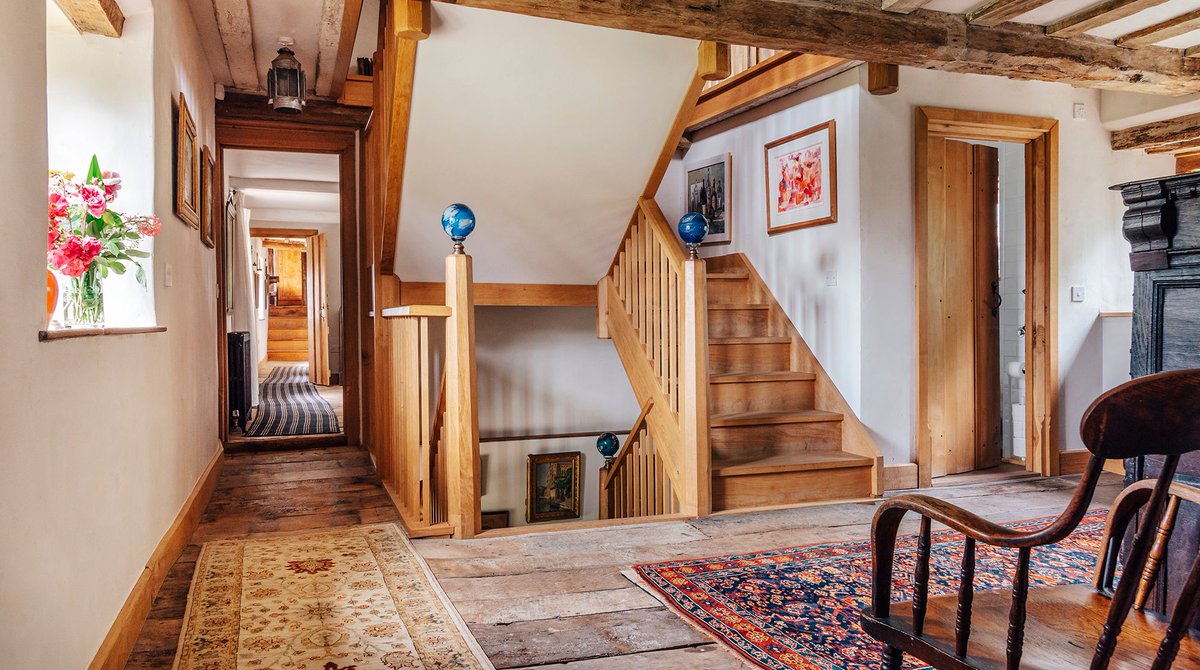 The central landing here at Hales Hall with our feature oak staircase and collection of Kilim rugs. 
.
📸@licooper_photography <a href="/plumguide/">Plum Guide</a>
.
#weddingvenue #staycation #countryescape  #luxury #worldsbesthomes #holidayuk #norfolk #interiors #unique #bighouseholiday #familyholiday