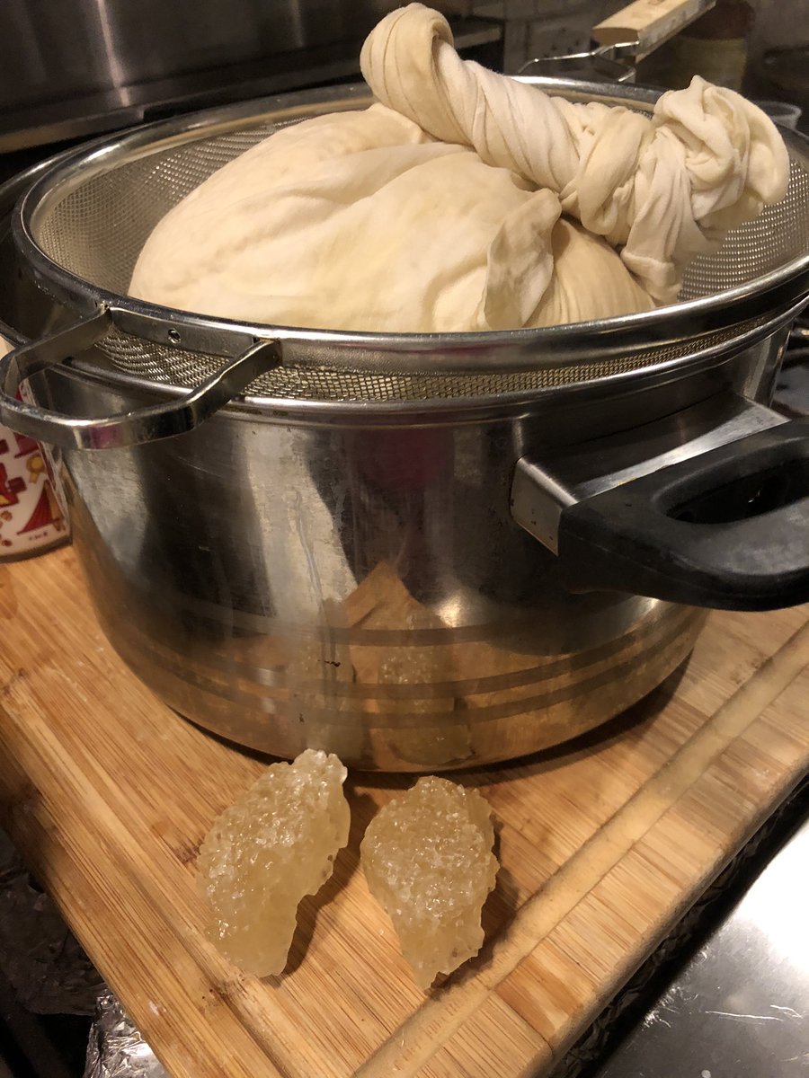Last steps: squeezed the remaining milk from the cloth which is sitting over a fine mesh strainer. Added a few chunks of rock sugar, not processed white sugar. When I asked how much, mom just gave me A LOOK Should have known better 