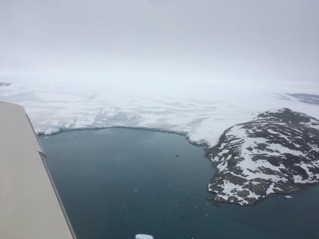 Where the ice shelf meets the ocean: not a good place for engine rumble. Later turns out to be just nosewheel shimmy, but we don't know that yet and are happy to get to a rainy Kulusuk.