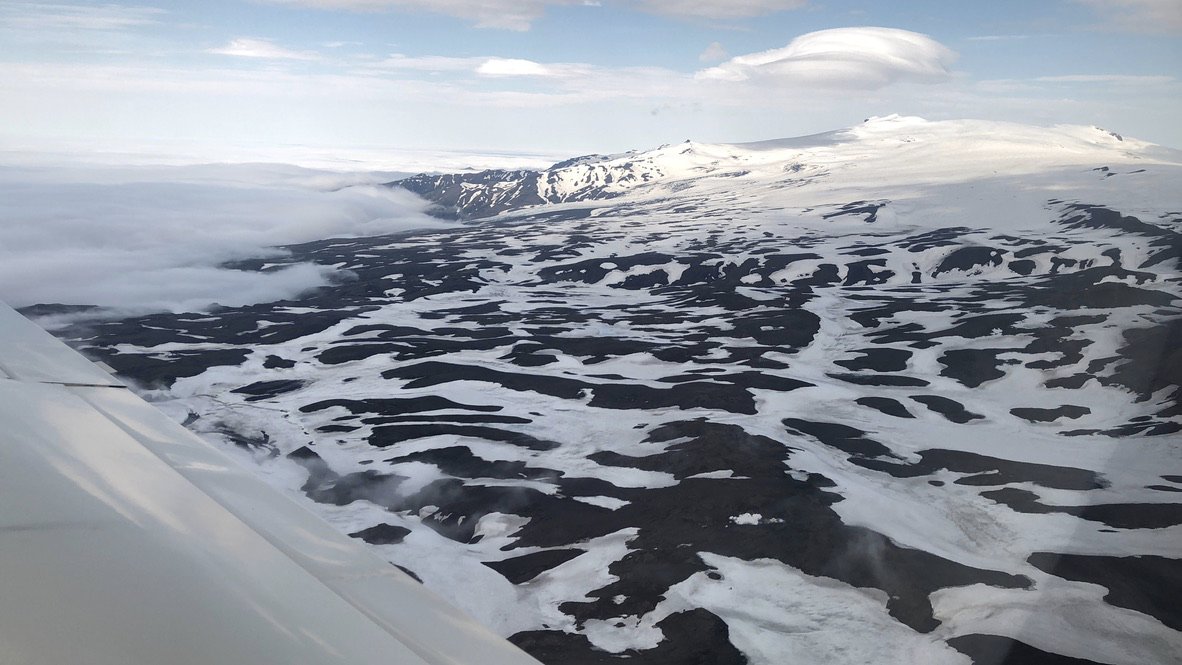 Next day is nosewheel fixing day, then we leave Reykjavik and head for Scotland. The longest overwater leg, 640 NM: last day for survival suits and nervous glances at the raft.On the way out we pass The Volcano That Cannot Be Pronounced**[ˈeiːjaˌfjatl̥aˌjœːkʏtl̥]