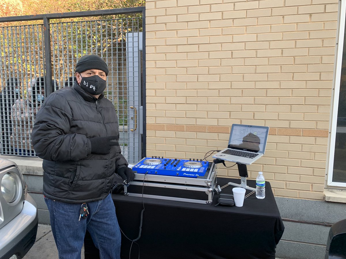 DJ BR is playing old school R&B to entertain voters waiting in the line at McDaniel Elementary.“I got the small speakers out now to let people wake up, but at 10 a.m. the big speakers are coming out. We’re going to party.”