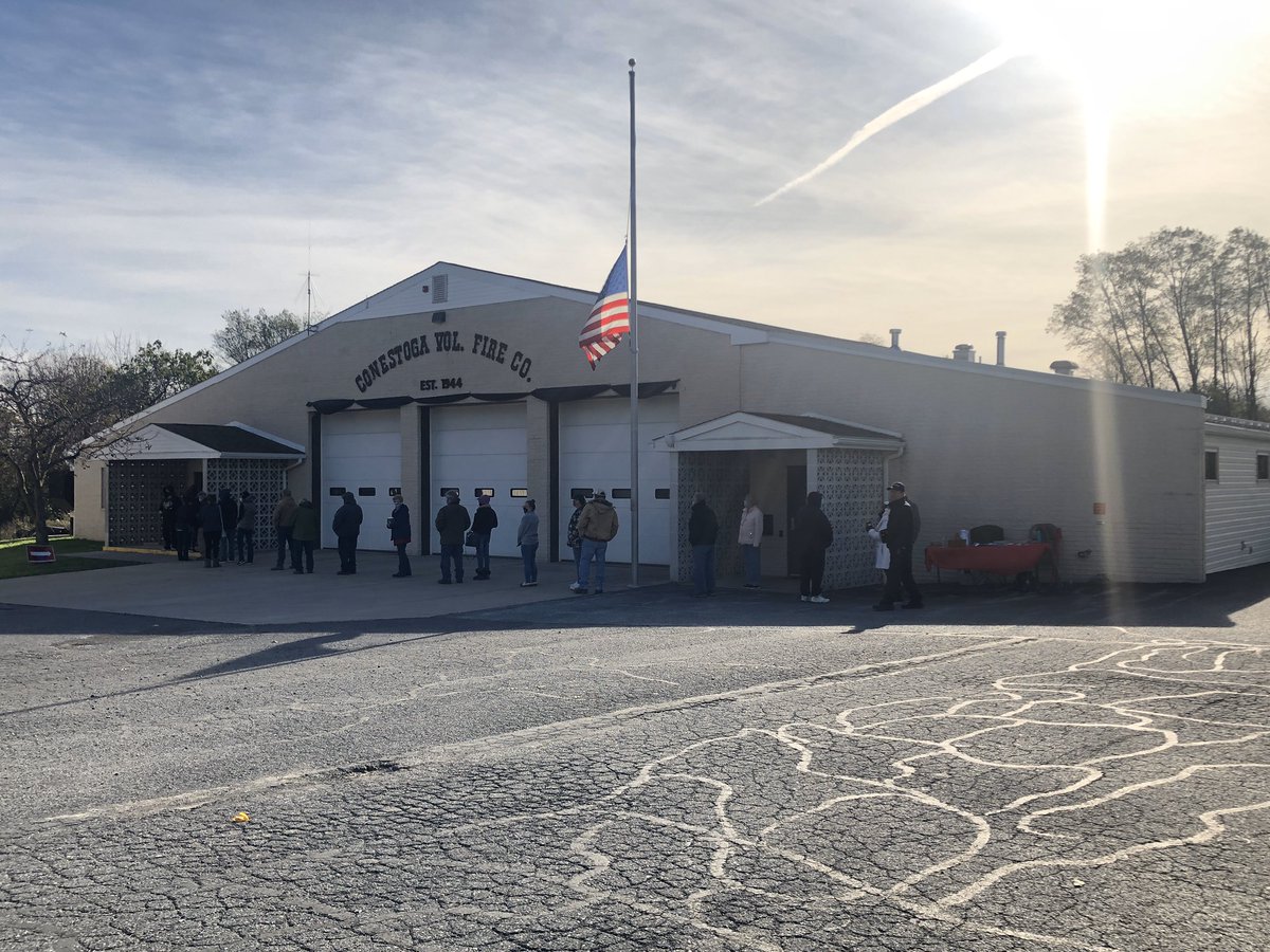 LNPjunior's tweet photo. I’m now at Conestoga Fire Hall on Main Street. Steady traffic as about 20 or so people wait in line outside the fire hall. This exact spot voted more than 3-1 for Trump over Clinton in 2016. https://t.co/vH4c0ypkoz