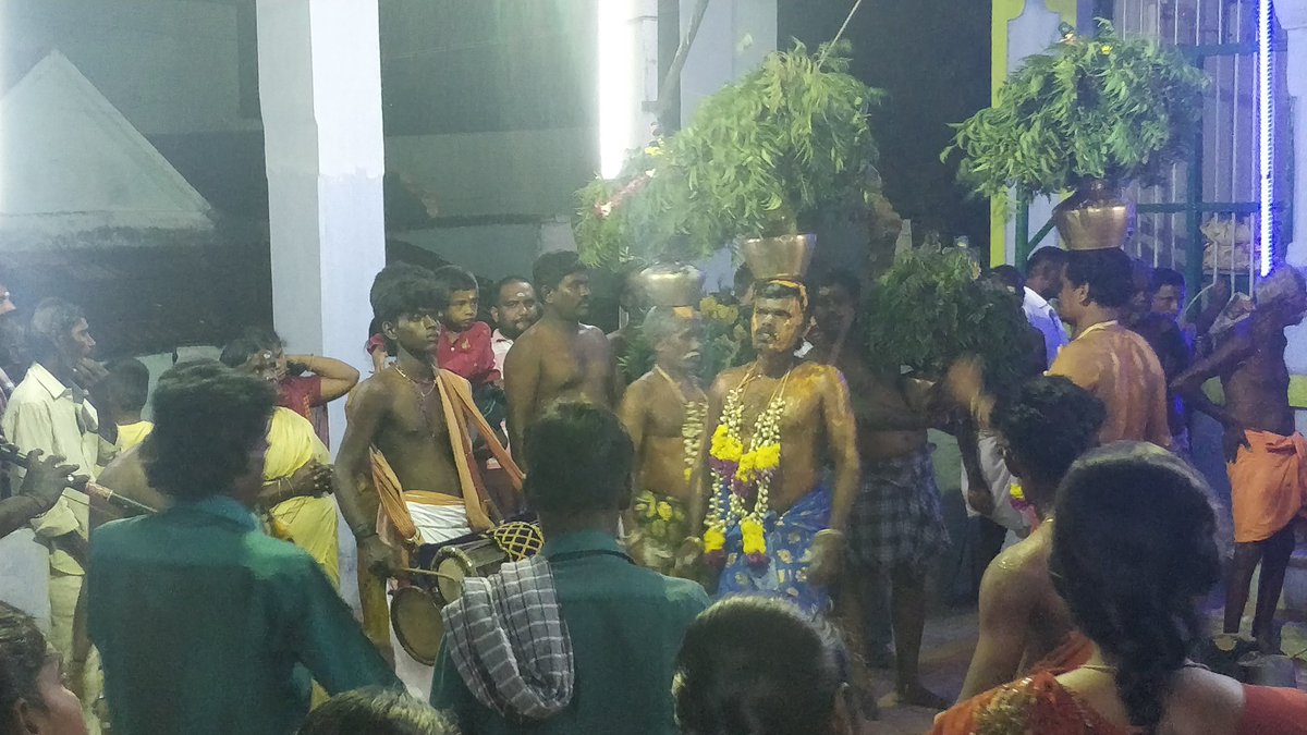 Once the archanai ends, temple saami comes around with archanai plate and the saami kondati's distribute thiruneer.