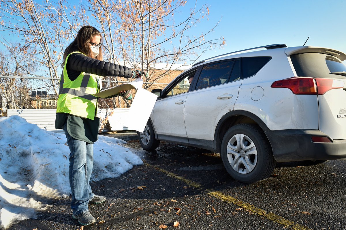 Outside is a the "vote and park" operation where voters remain in their vehicles while election volunteers act as proxies by running their ballots and voter registration into the building. #mtpol  #mtnews  #mtvotes