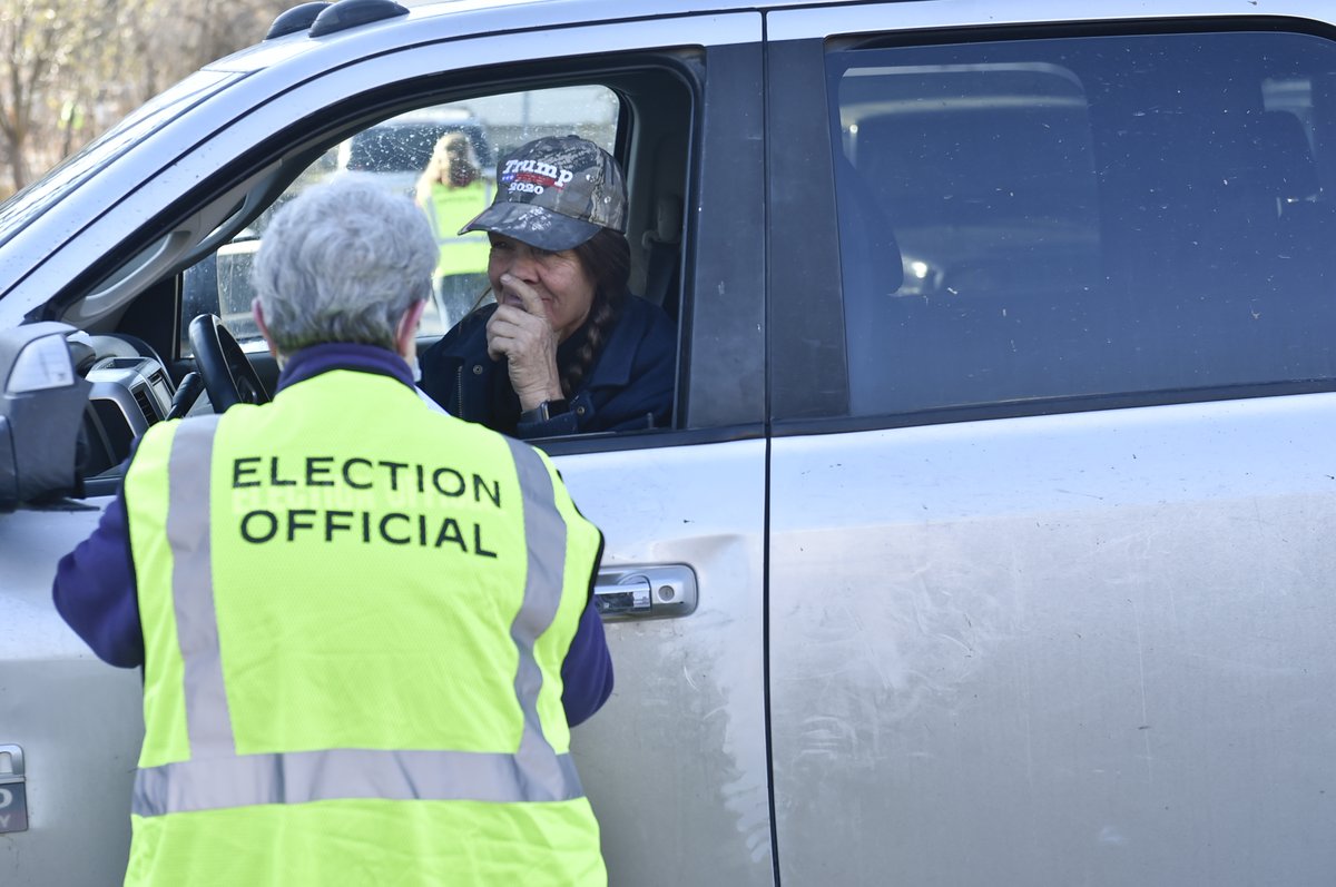 Outside is a the "vote and park" operation where voters remain in their vehicles while election volunteers act as proxies by running their ballots and voter registration into the building. #mtpol  #mtnews  #mtvotes