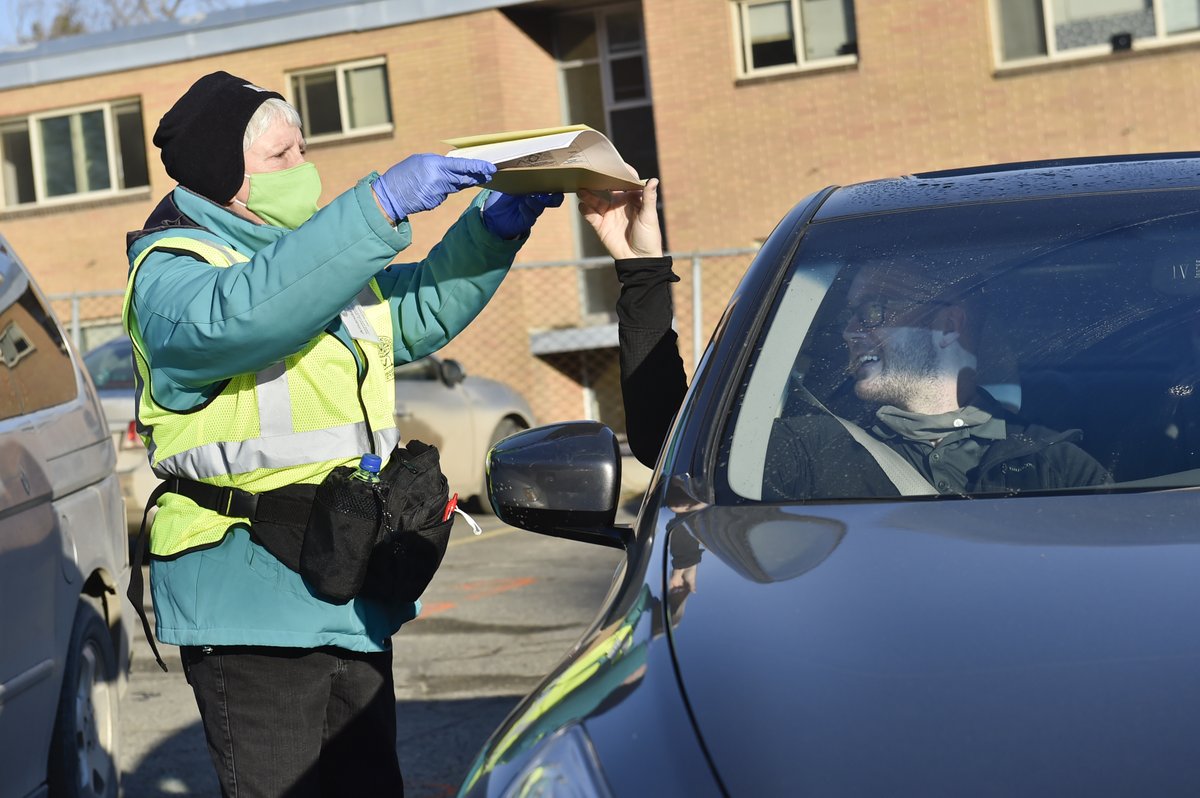 Outside is a the "vote and park" operation where voters remain in their vehicles while election volunteers act as proxies by running their ballots and voter registration into the building. #mtpol  #mtnews  #mtvotes