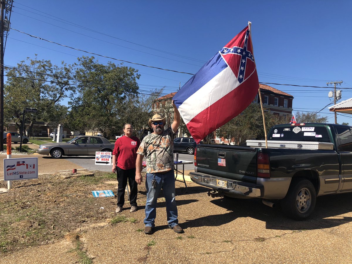 This is Monticello, MS. Nina Hill (left) is set up at a precinct asking for volunteers for a petition to reverse the state flag change, done by the Legislature in June, and put it to a people’s vote. She said she’s not asking people to vote NO on the current ballot init though...