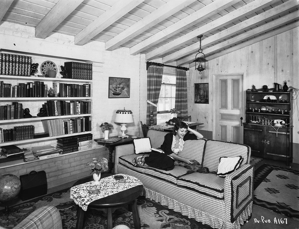 Ann giving Heinzie belly rubs inside her Encino home, 1935.