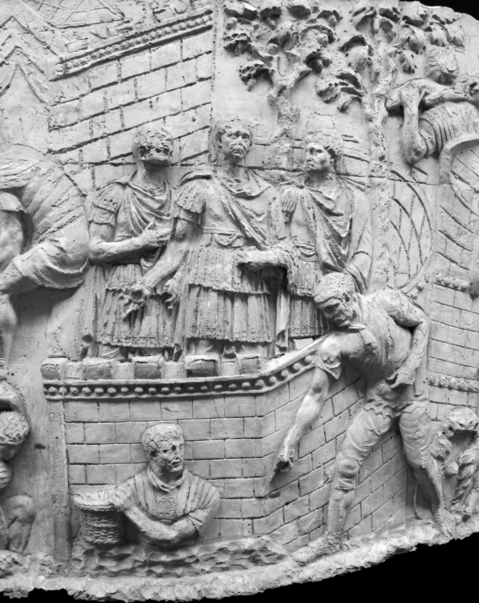 The images of these scenes highlight this clearly. Below are the images from scene XII (1). In the image of the full scene, we see many Romans working together to build the fort. Trajan, however, is just standing there, not participating in the actual efforts of construction. /3