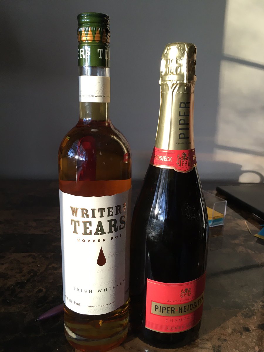 Bottle of champagne and bottle of writer’s tears whiskey