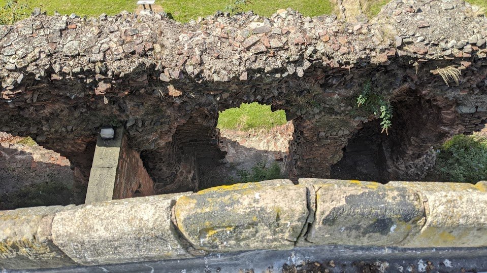 Ironically, despite the builders stealing Roman bricks and tiles to build St Nicholas, they built it so close to the ruins that they led to the accidental preservation of what is now one of the largest pieces of Roman masonry in England.How close is the church? This close.