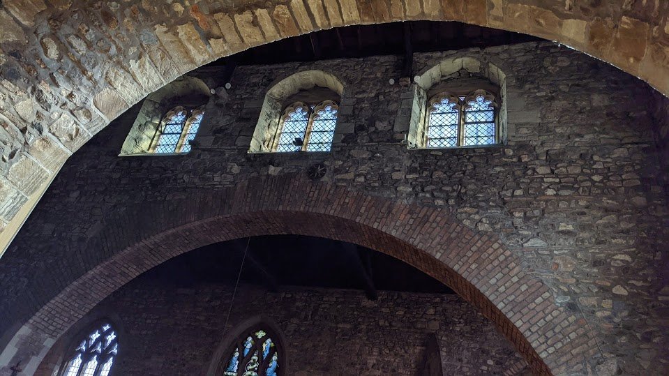 The Victorians added aisles to the church, and knocked out much of the south wall of the nave, adding in this big brick arch to shore up the crumbling church and stop it falling down. They also took apart, rebuilt, and stabilised the top tiers of the tower.