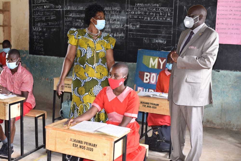 Education CS Prof. George Magoha  at Mukambi Primary School in Kakamega County on Friday to assess supply of desks under the locally Assembled desk for schools stimulus project.