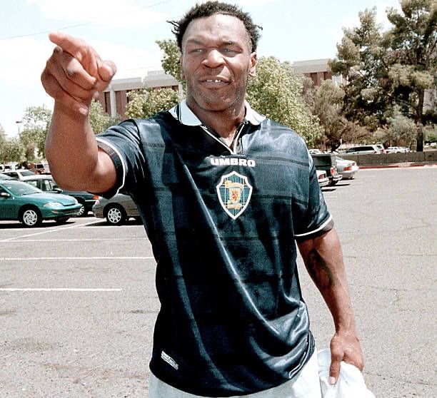 The tartan pattern wouldn’t be seen again until the ‘98 shirt, where it was used behind the crest and on the trim of the collar. Also while I was searching for it I found this picture of Mike Tyson