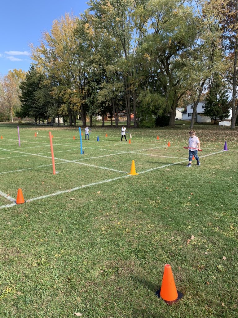Students are enjoying this beautiful day outside, driving their hula-hoop cars safely around the race track!!! ☀️🏁🏎