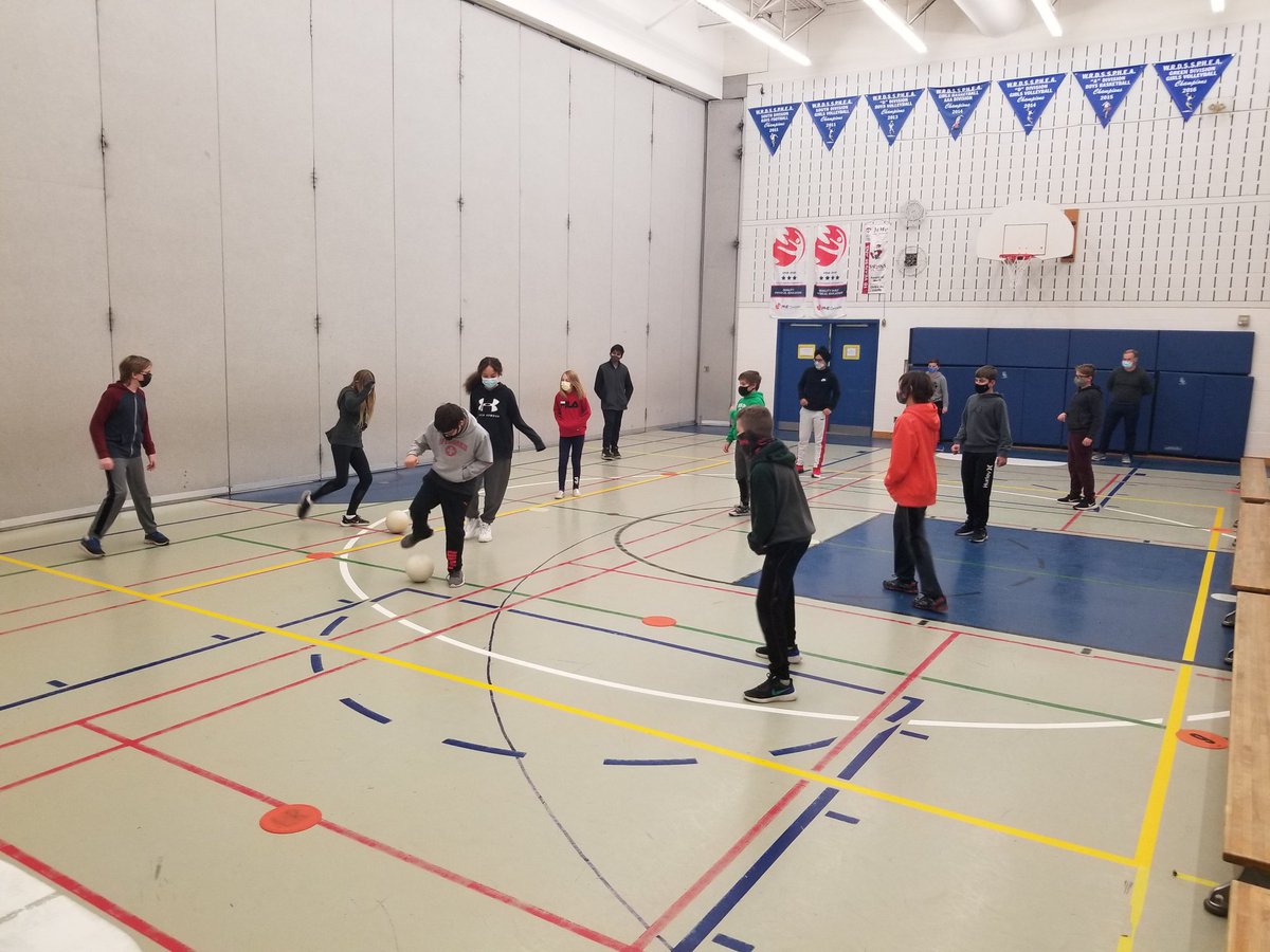 GilhespyKim's tweet photo. Human foosball @Clemens_Mill this rainy week. First time in the gym; staying in our zones, masks on. First time using equipment; 2 balls, touched using feet. #stayingsafe #physicaldistancenotsocialdistance #learningPEduringCOVID @PHECanada @opheacanada @CIRAOntario https://t.co/iWttS2uOWl
