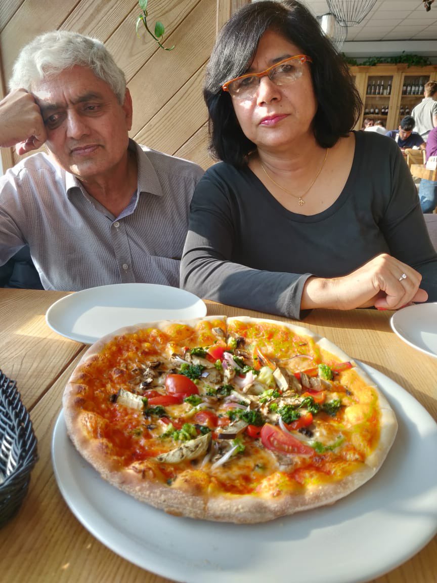 Even  #pizza at a lovely cafe in an Italian village cannot make him part with his sulk even though he tries hard. What ya,  @francescam63!  #HappyBirthday, father.