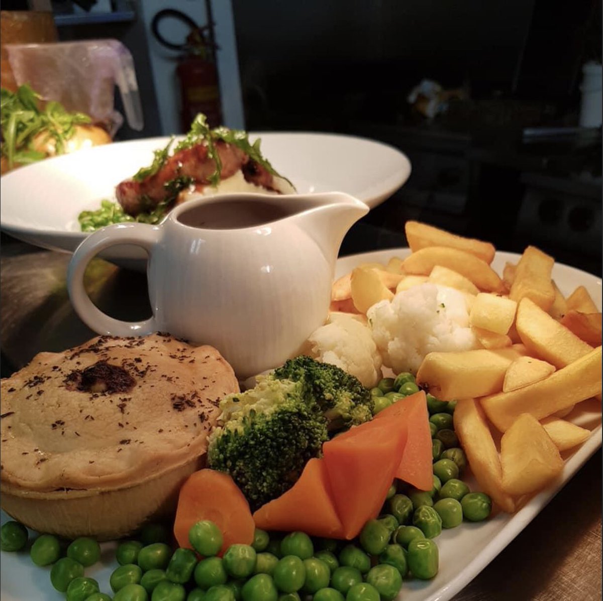 One of our many popular dishes, steak and ale pie and chips.